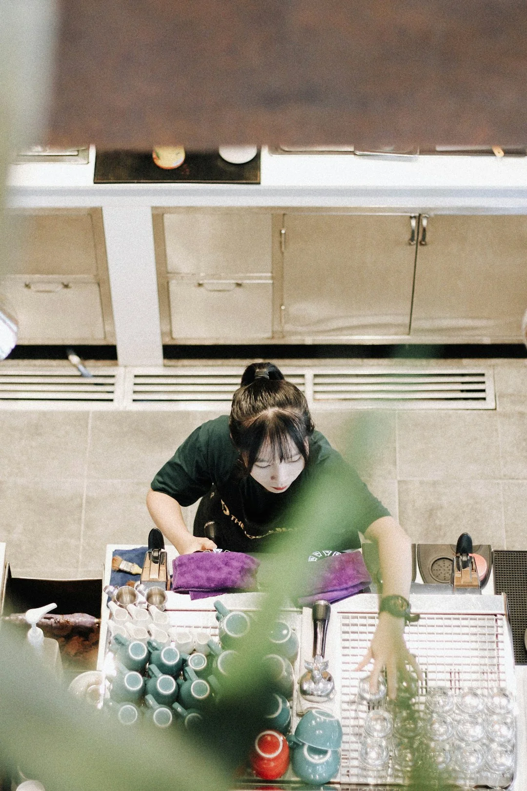 home-img A person in personal protective equipment vacuuming indoors, ensuring a thorough clean.